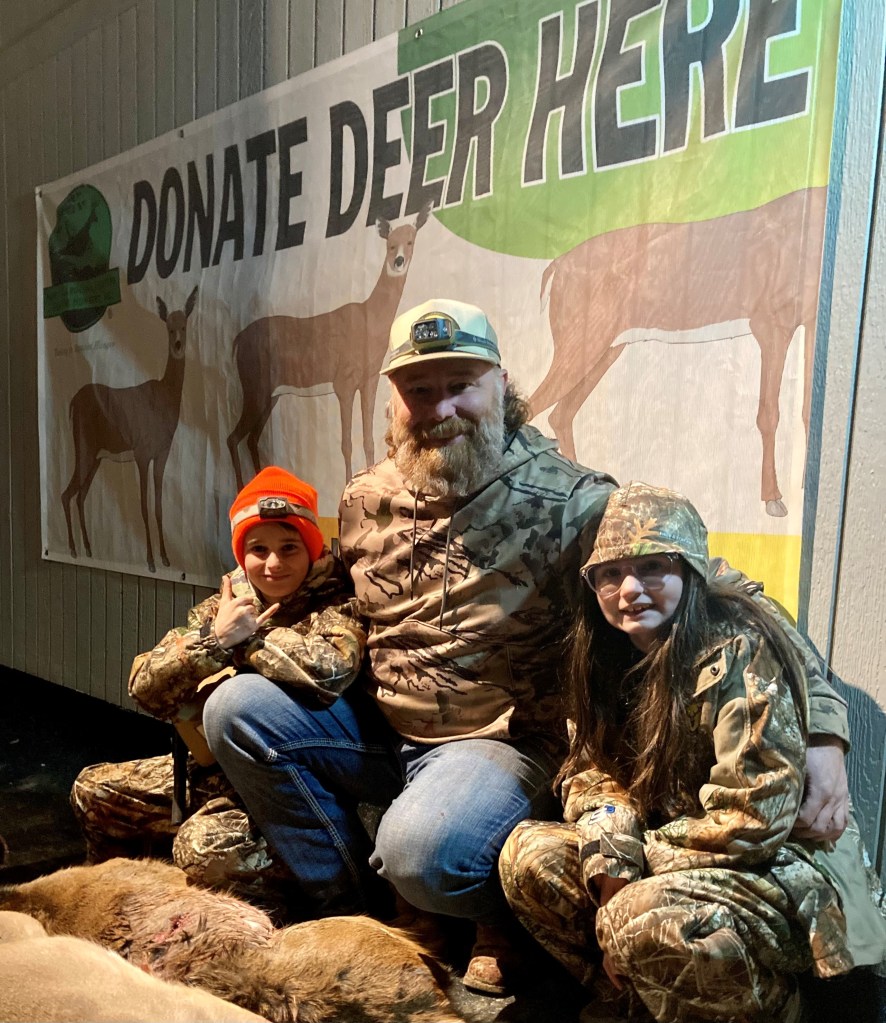 Father with Kids after Deer Hunt