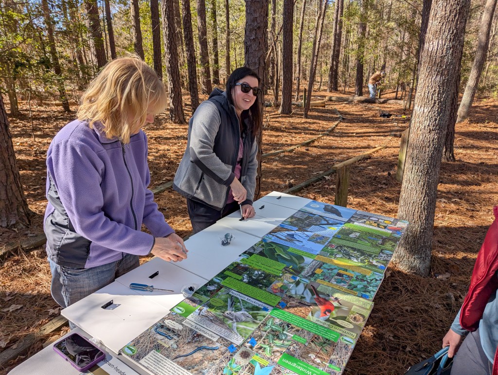 People assembling signs
