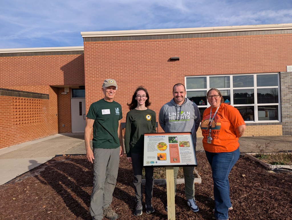 SWC, NCWF, and school staff at the new sign